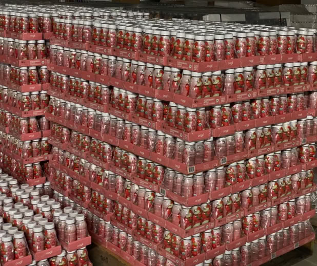 Beverages packed in trays for Costco and stacked on pallets for distribution at Nutrition Labs 