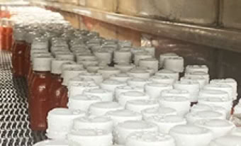 Energy shots cooling in tunnel after hot fill at Nutrition Labs