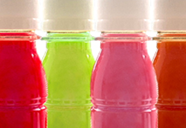 Energy shot bottles prepared for hot filling at Nutrition Labs beverage co-packing facility